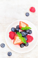 souffle cake with fresh raspberries, blueberries and strawberrie
