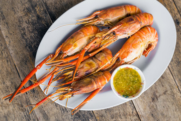 Grilled shrimps on white plate