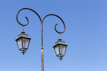 Fototapeta na wymiar street light against a blue sky background
