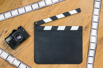 Blank film slate, vintage camera and film