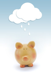 Piggy bank with paper cloud and rain above.