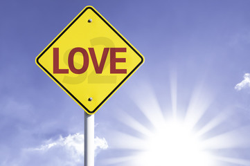 Obraz premium Love road sign with sun background