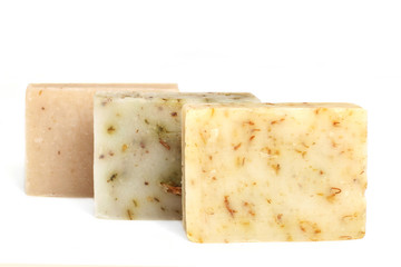 bars of natural soap with dried herbs - 67842396