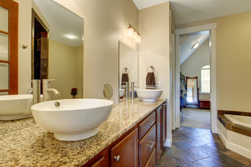 Fototapeta na wymiar Modern bathroom vanity cabinet with vessel sinks