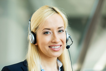 Female customer service representative using hands free device