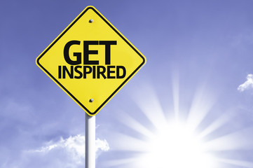 Get Inspired road sign with sun background