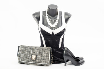 Black and white dress on mannequin with matching accessories