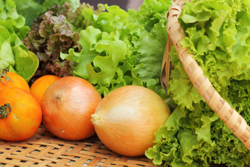 Vegetables salad and tomato in the basket