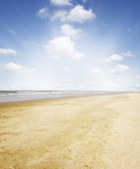Fototapeta na wymiar Beach golden sand, sea and sunny sky