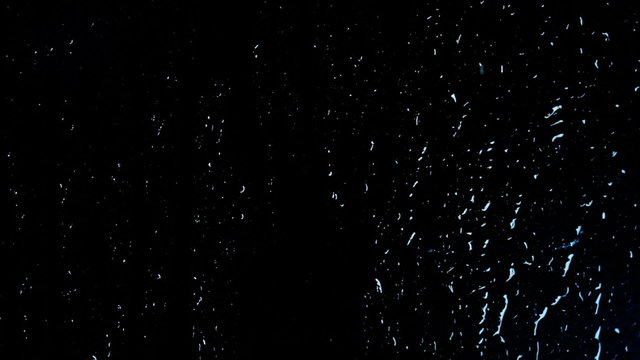 night raindrops running down the glass