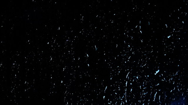 Night Raindrops Running Down the Glass