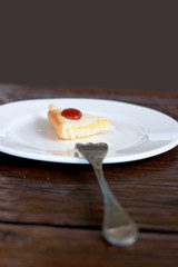 Sandwich bread on a plate and cutlery.