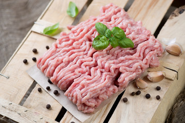 Ground turkey meat with green basil, pepper and garlic
