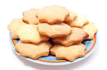 Fresh homemade cookies on colorful plate. White background