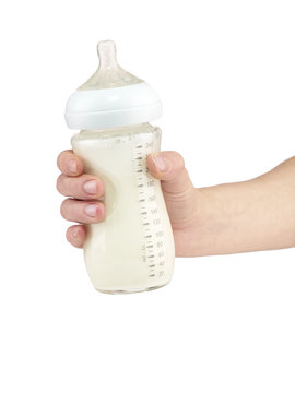 Mother prepares baby milk formula.