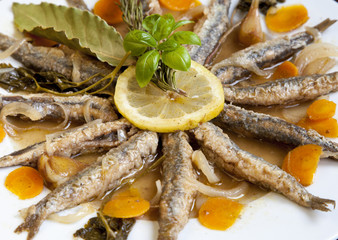 Tasty Marinated sardines with Mediterranean herbs, close up