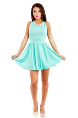 beautiful young slim brunette woman wearing a blue dress isolate