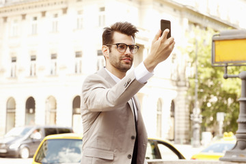 Businessman taking selfie