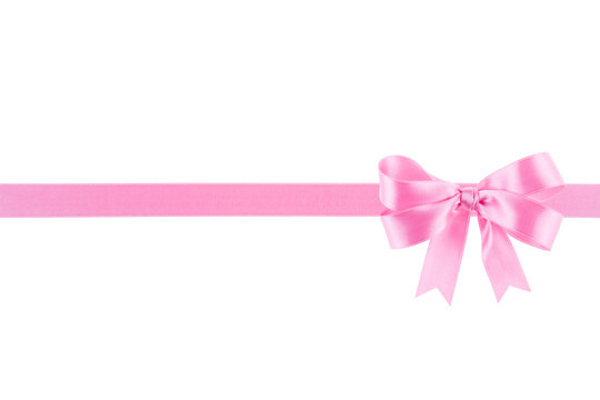 Pink ribbon with a bow on white background