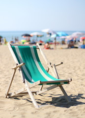Fototapeta premium deck on beach with many umbrellas in summer