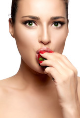 Beautiful Young Woman Eating Strawberry