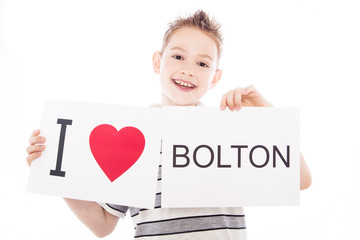 Boy with Bolton city sign