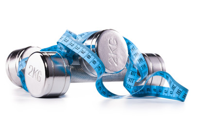 fitness equipment  and measure tape isolated on white