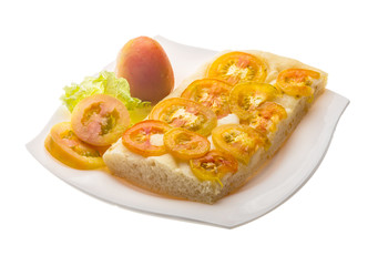 Pizza with sliced tomato