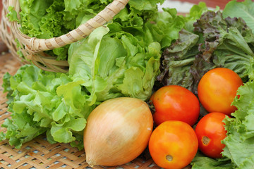 Vegetables salad and tomato in the basket
