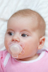 adorable baby with pacifier
