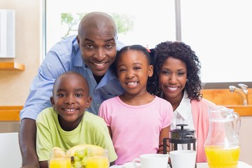 Happy family having breakfast together in the morning