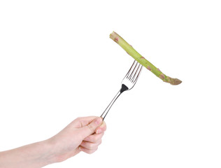 Green fresh asparagus on fork.