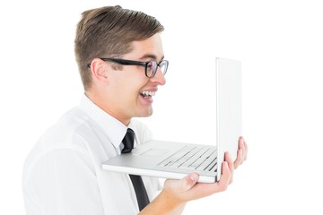 Geeky businessman holding his laptop