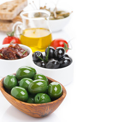 assorted antipasti - olives, pickles, olive oil and ciabatta
