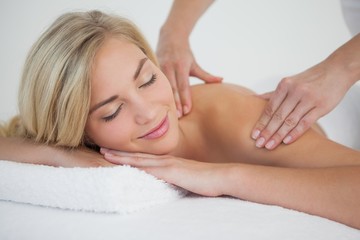 Obraz na płótnie Canvas Pretty blonde enjoying a massage