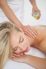 Obraz na płótnie Canvas Beautiful blonde enjoying a back massage