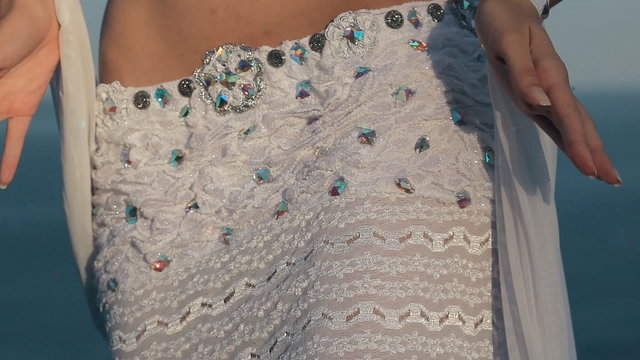 Beautiful girl perform belly dance on the rock in Crimea