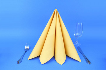 Folded napkin on the white plate