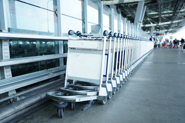 Trolleys luggage in a raw in airport
