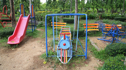 Train and slider toys at old children playground