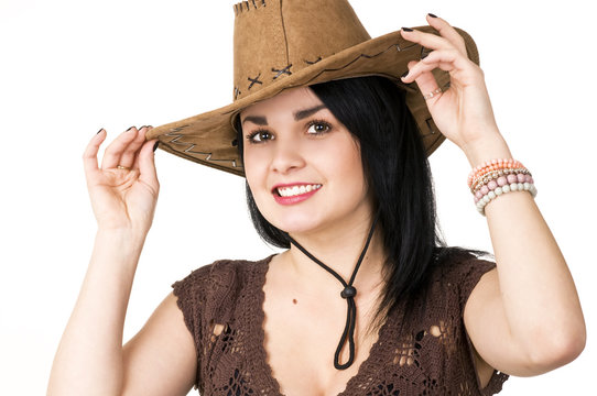 A beautiful woman in a cowboy hat.