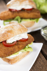 Homemade Fishburger on wooden background