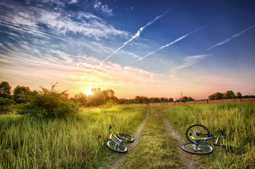 Two bicycles in sunrise