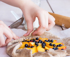 biscuit cooking with peaches and blueberries