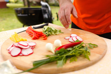 man cutting vegetables