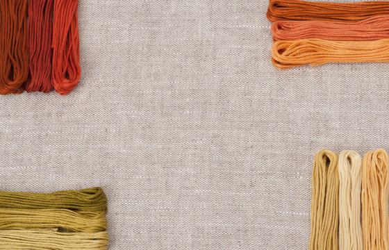 Colorful Threads Set. Natural Linen Background