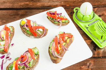 Brown bread with avocado, smoked salmon, boiled egg