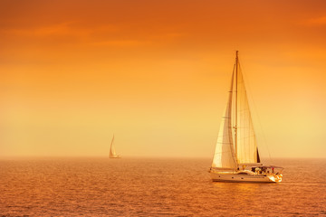 Sailing ship yachts with white sails