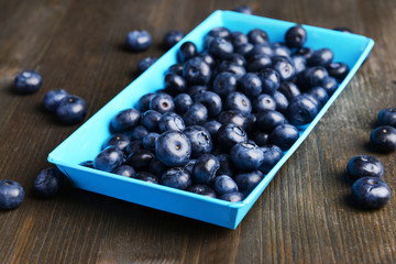 Delicious blueberries on table close-up