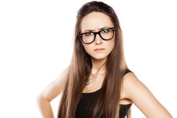 Fototapeta premium angry young woman with glasses on white background